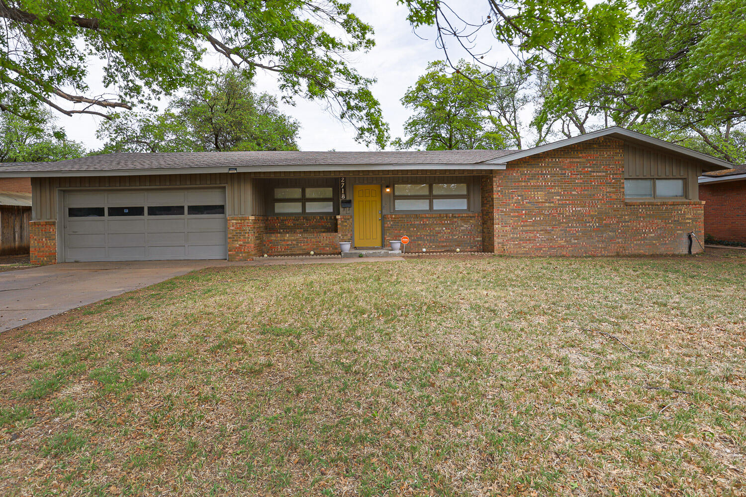 2718 55th Street Lubbock, TX 79413 - Photo 2 of 58 a house with a tree in front of it