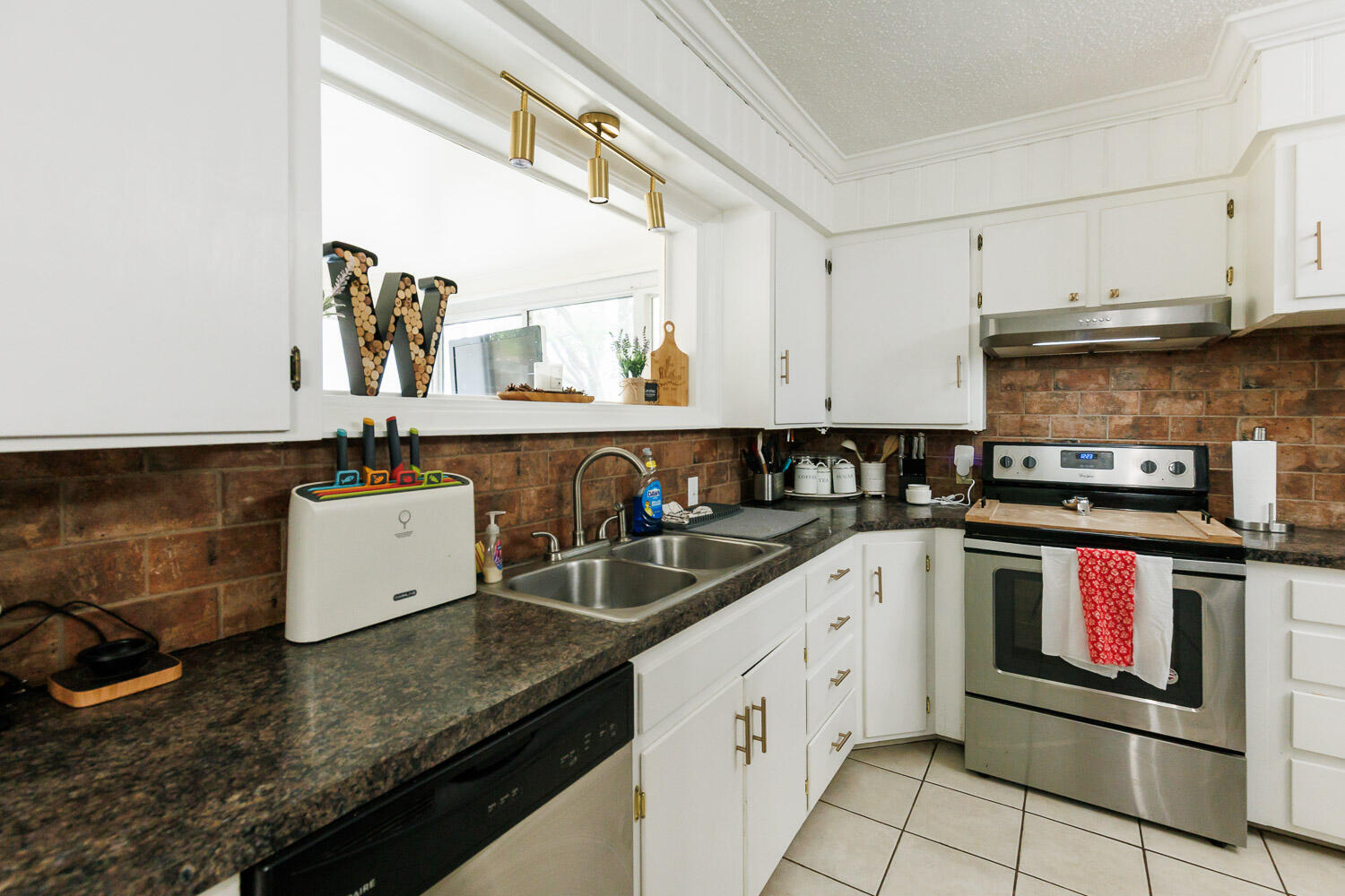 2718 55th Street Lubbock, TX 79413 - Photo 22 of 58 a kitchen with a sink and stove