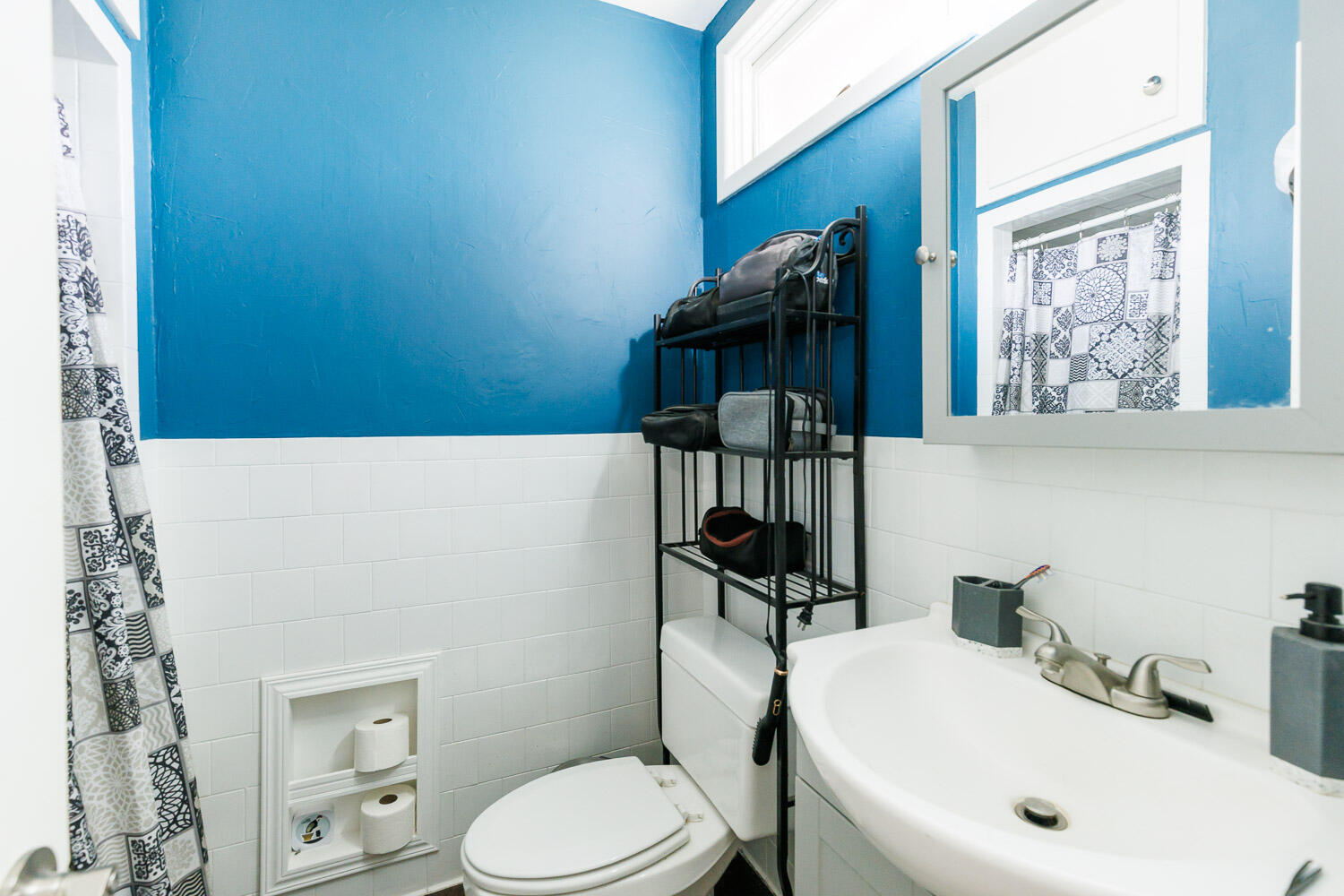 2718 55th Street Lubbock, TX 79413 - Photo 29 of 58 a bathroom with a toilet a sink and bathtub
