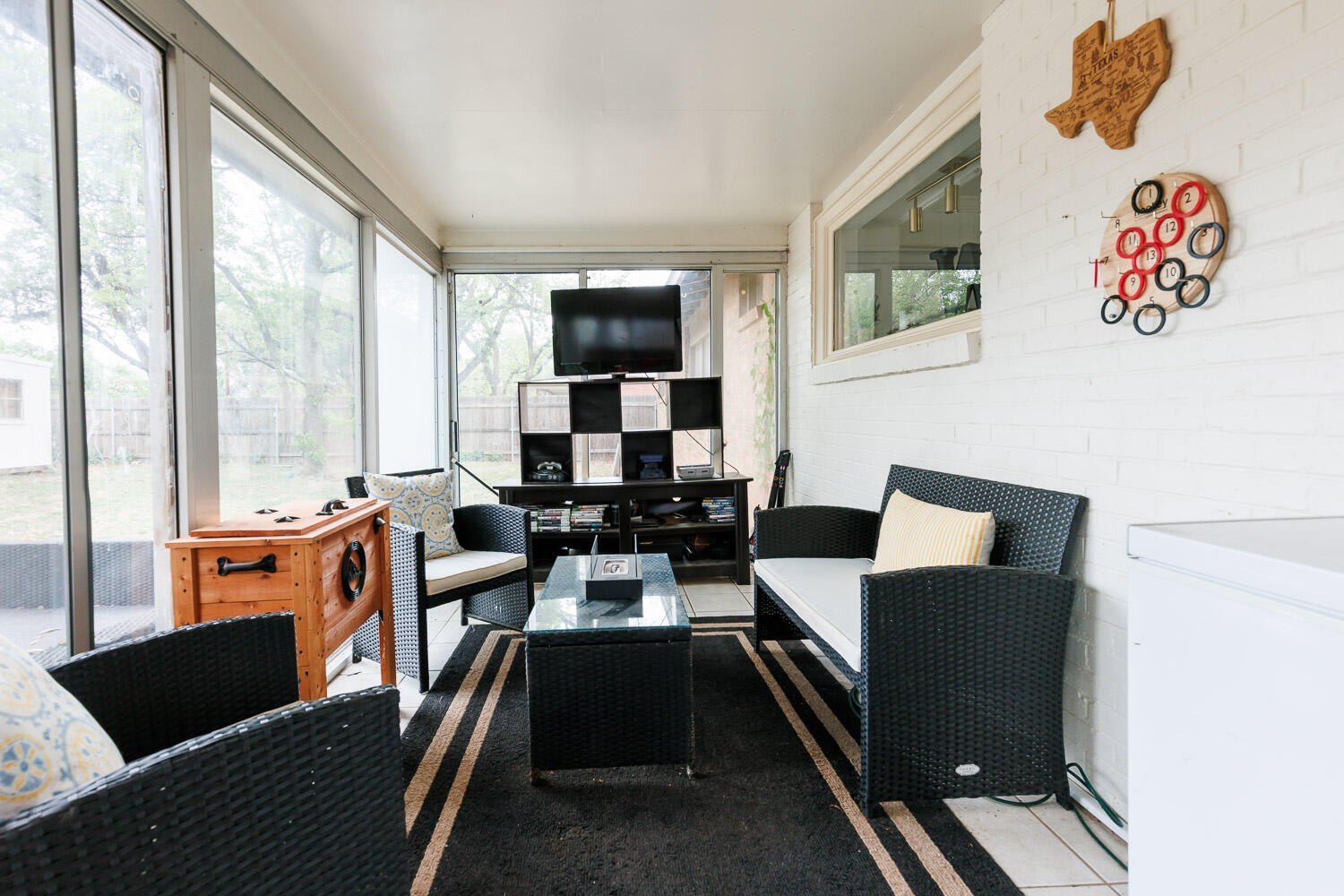 2718 55th Street Lubbock, TX 79413 - Photo 41 of 58 a living room with furniture and a floor to ceiling window