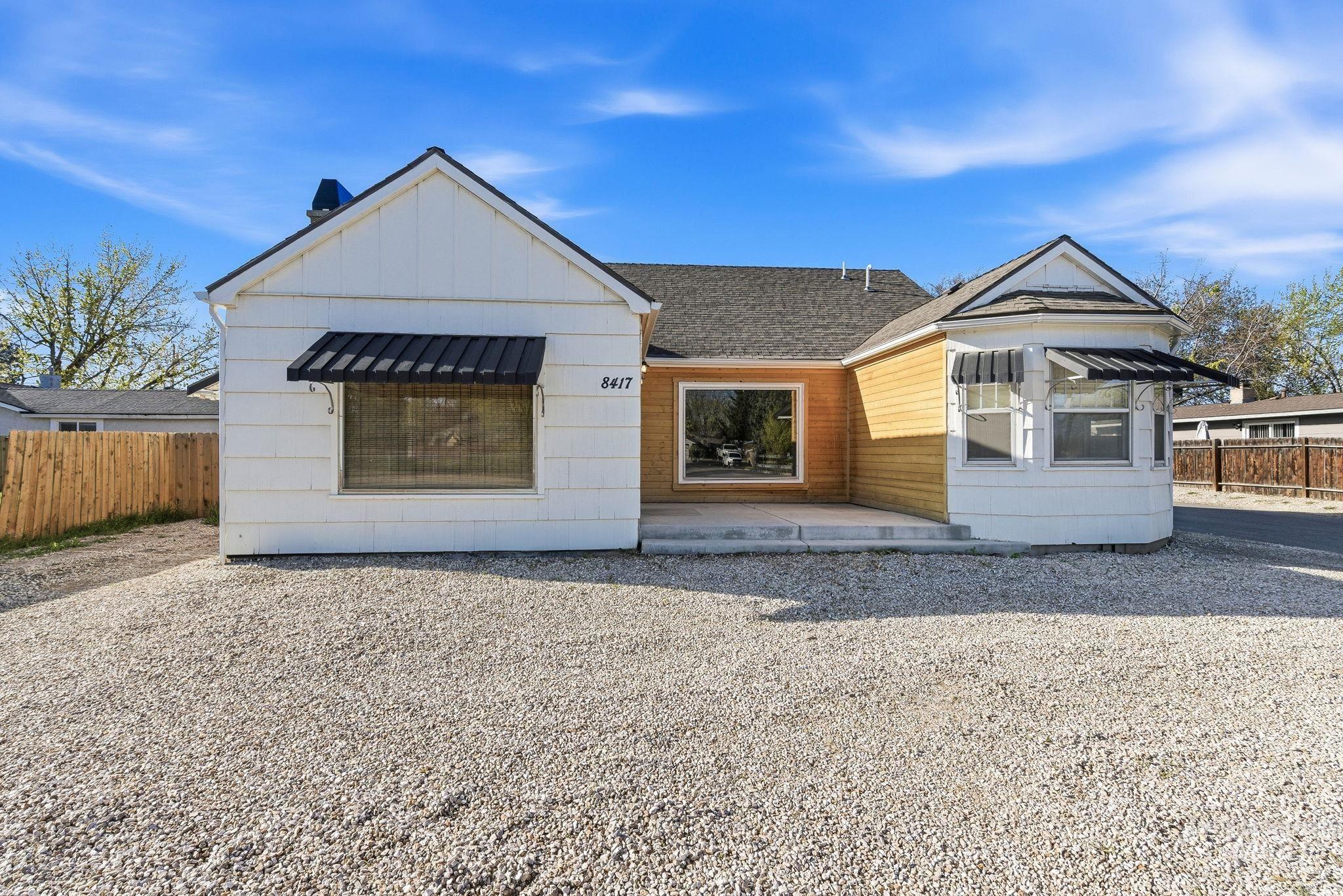 8417 West Goddard Road Boise, ID 83704 - Photo 1 of 1 View of front facade with a patio and board and batten siding