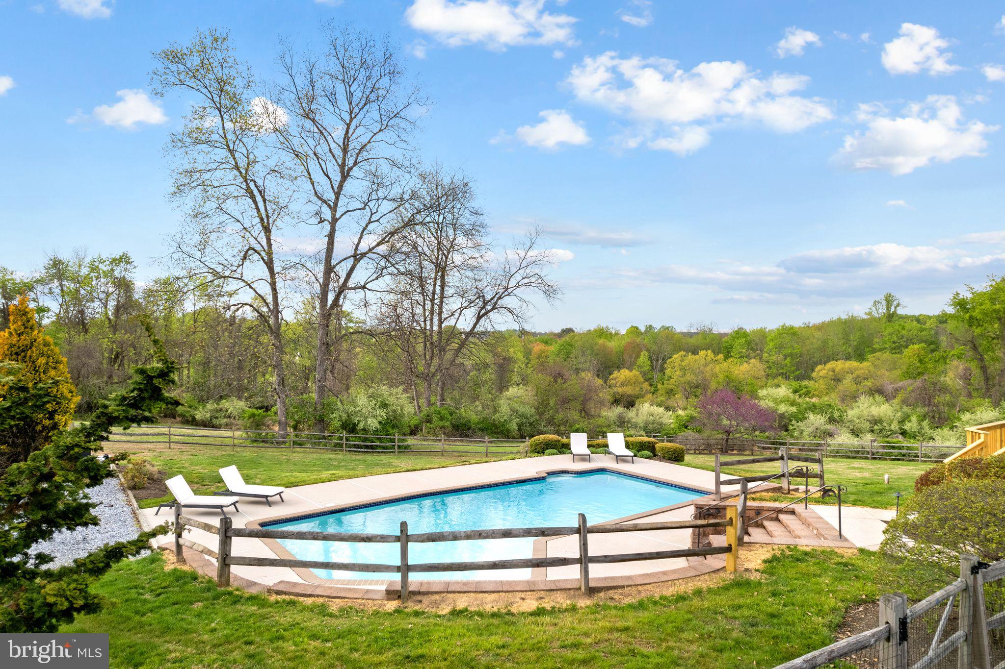 883 Echo Hill Road West Chester, PA 19382 - Photo 49 of 50 Serene poolside retreat in nature.