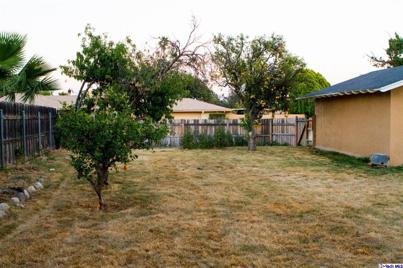 446 East Jackson Street Rialto, CA 92376 - Photo 5 of 6 a house with trees in the background