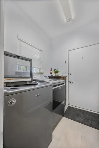 a kitchen with stainless steel appliances a sink stove and cabinets