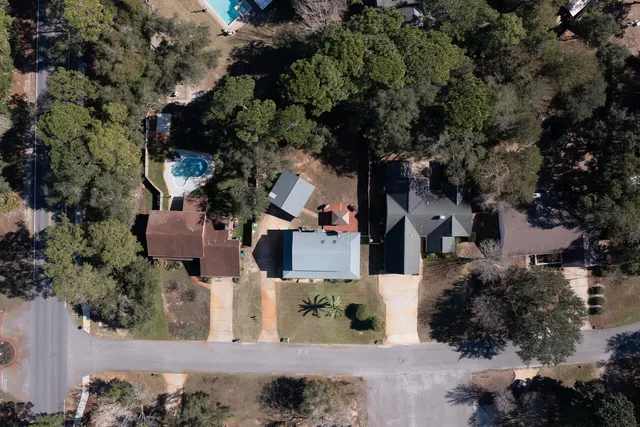 an aerial view of multiple houses with outdoor space
