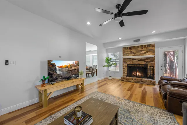 a living room with furniture and a fireplace