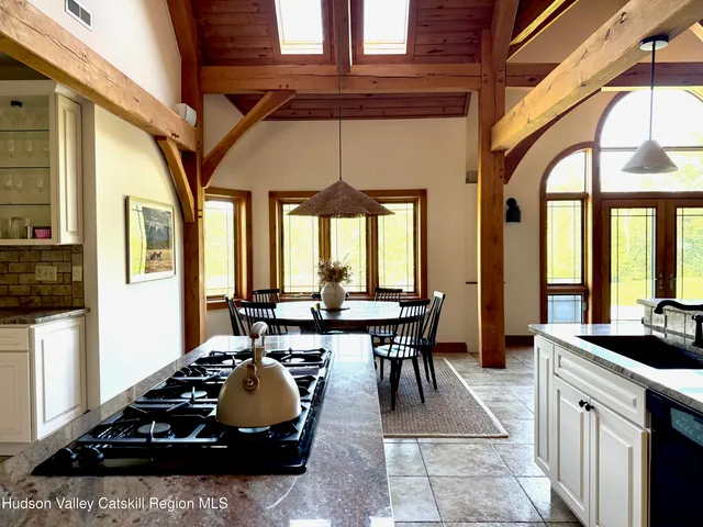 a lobby with furniture and floor to ceiling window