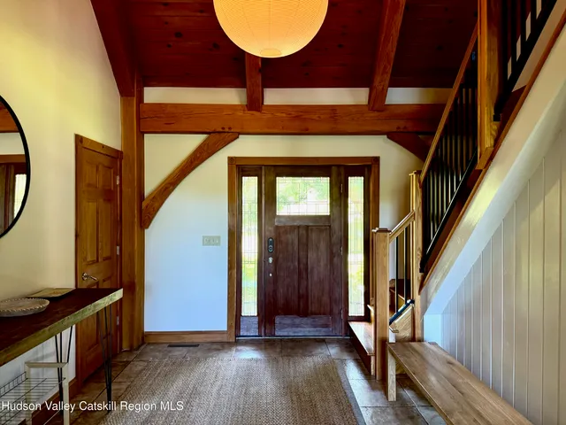 a view of an entryway with wooden floor