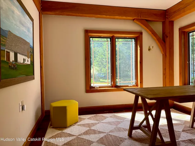 a view of a livingroom with furniture and windows