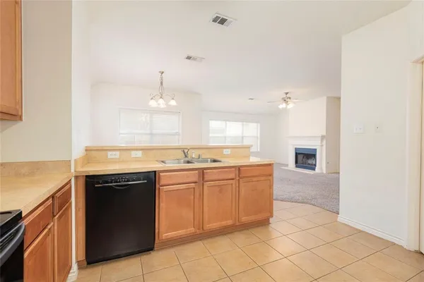 a large kitchen with cabinets
