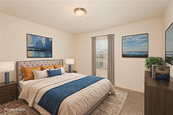 a bedroom with bed and window