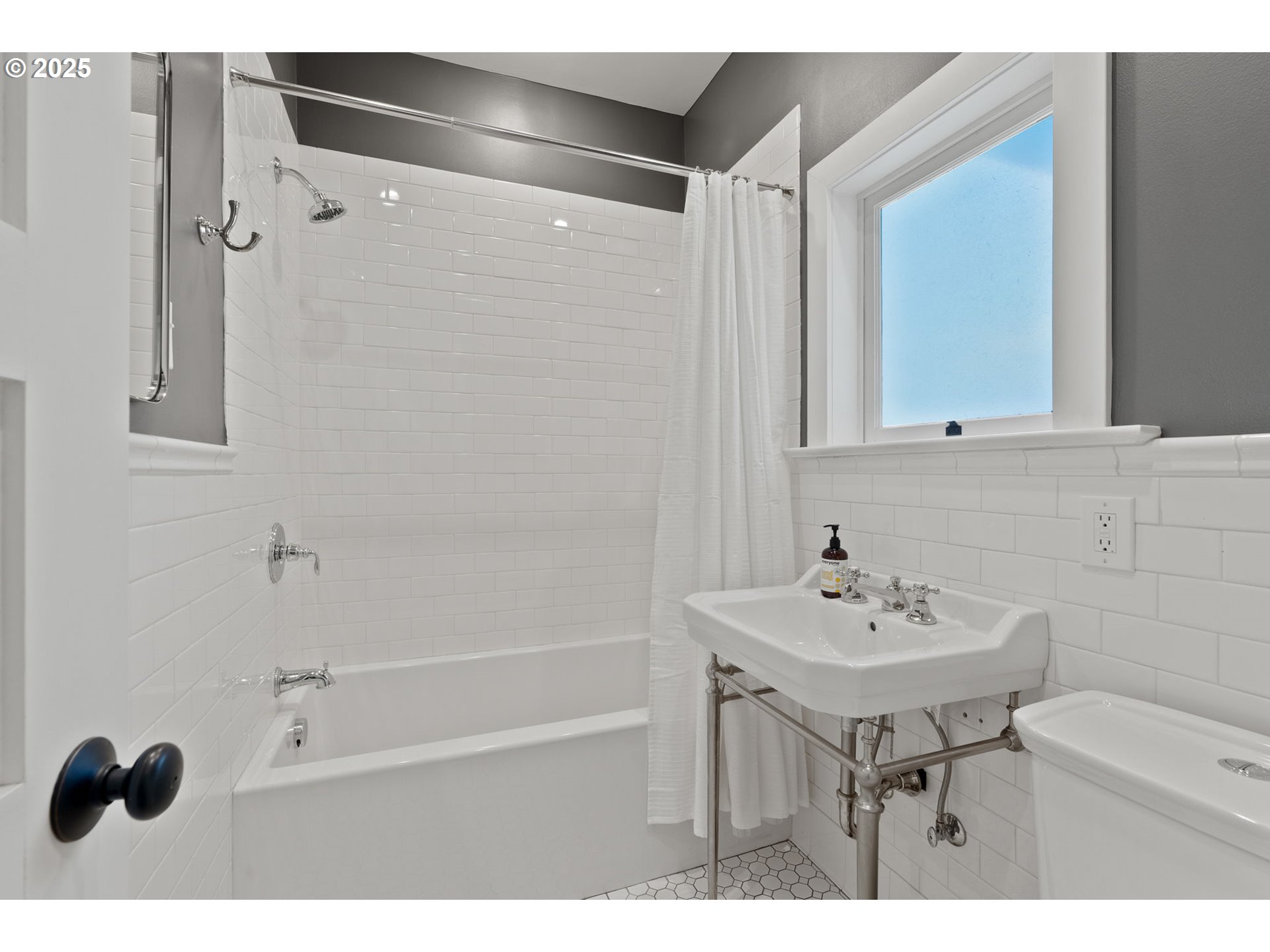 1912 Northeast 11th Avenue Portland, OR 97212 - Photo 11 of 41 a bathroom with a sink toilet and shower