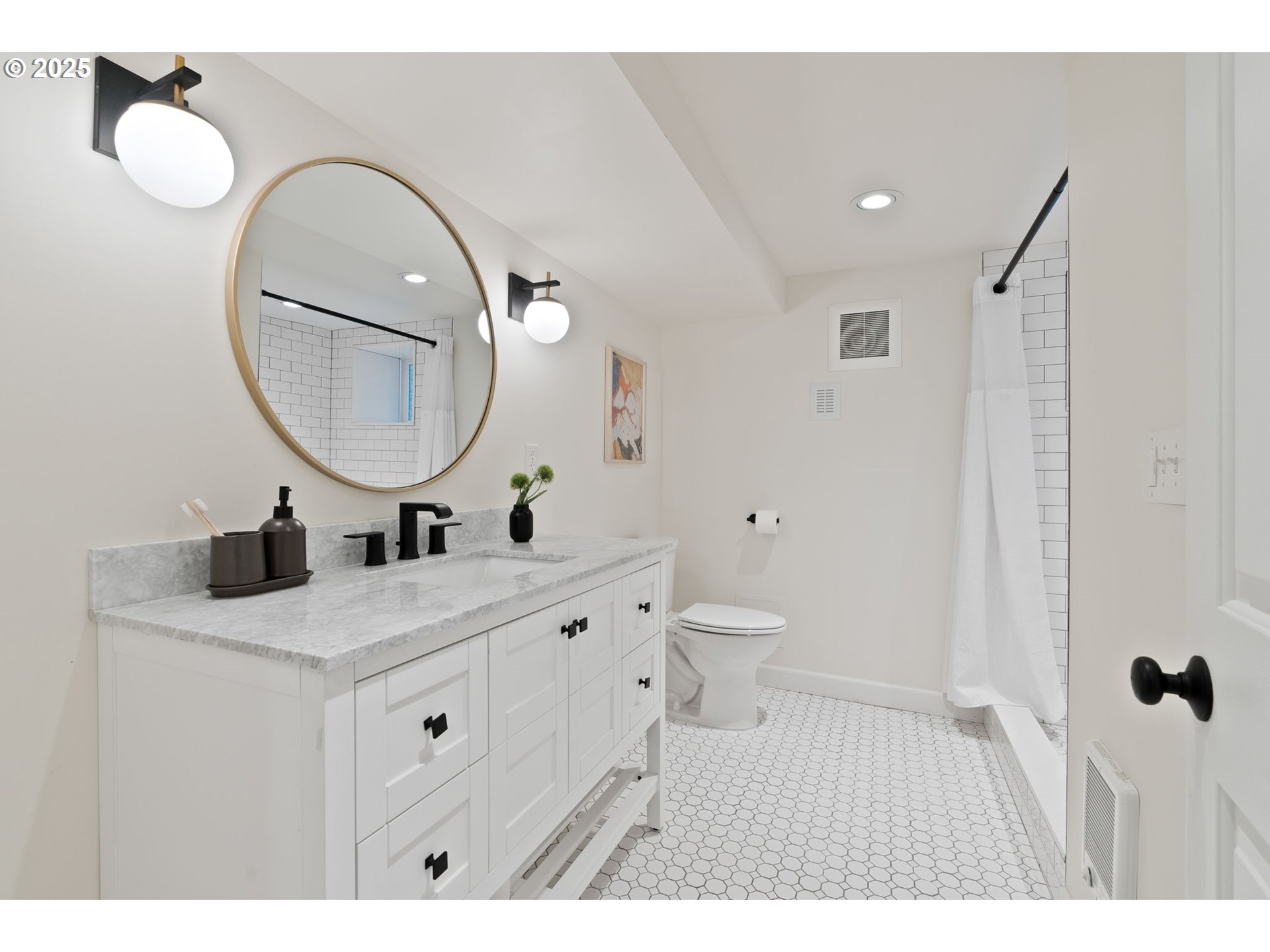 1912 Northeast 11th Avenue Portland, OR 97212 - Photo 24 of 41 a bathroom with a sink and a mirror