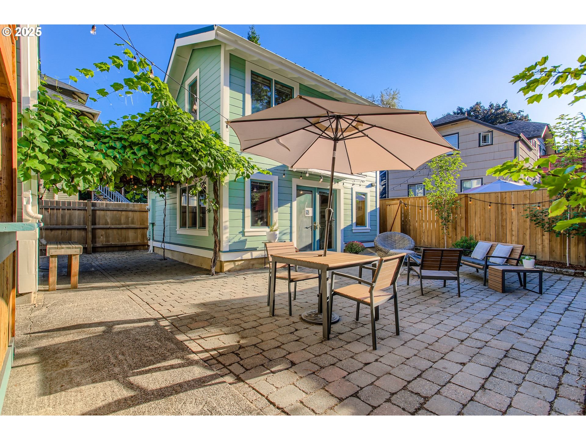 1912 Northeast 11th Avenue Portland, OR 97212 - Photo 33 of 41 a backyard of a house with barbeque oven table and chairs