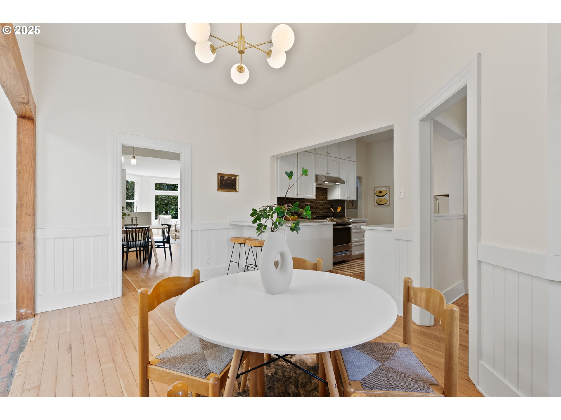 1912 Northeast 11th Avenue Portland, OR 97212 - Photo 9 of 41 a view of a dining room with furniture and wooden floor