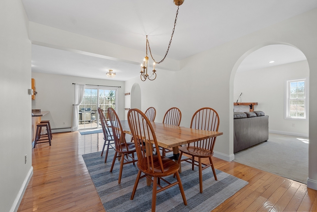 120 Farnsworth Road Templeton, MA 01468 - Photo 3 of 37 a dining room with furniture a chandelier and wooden floor