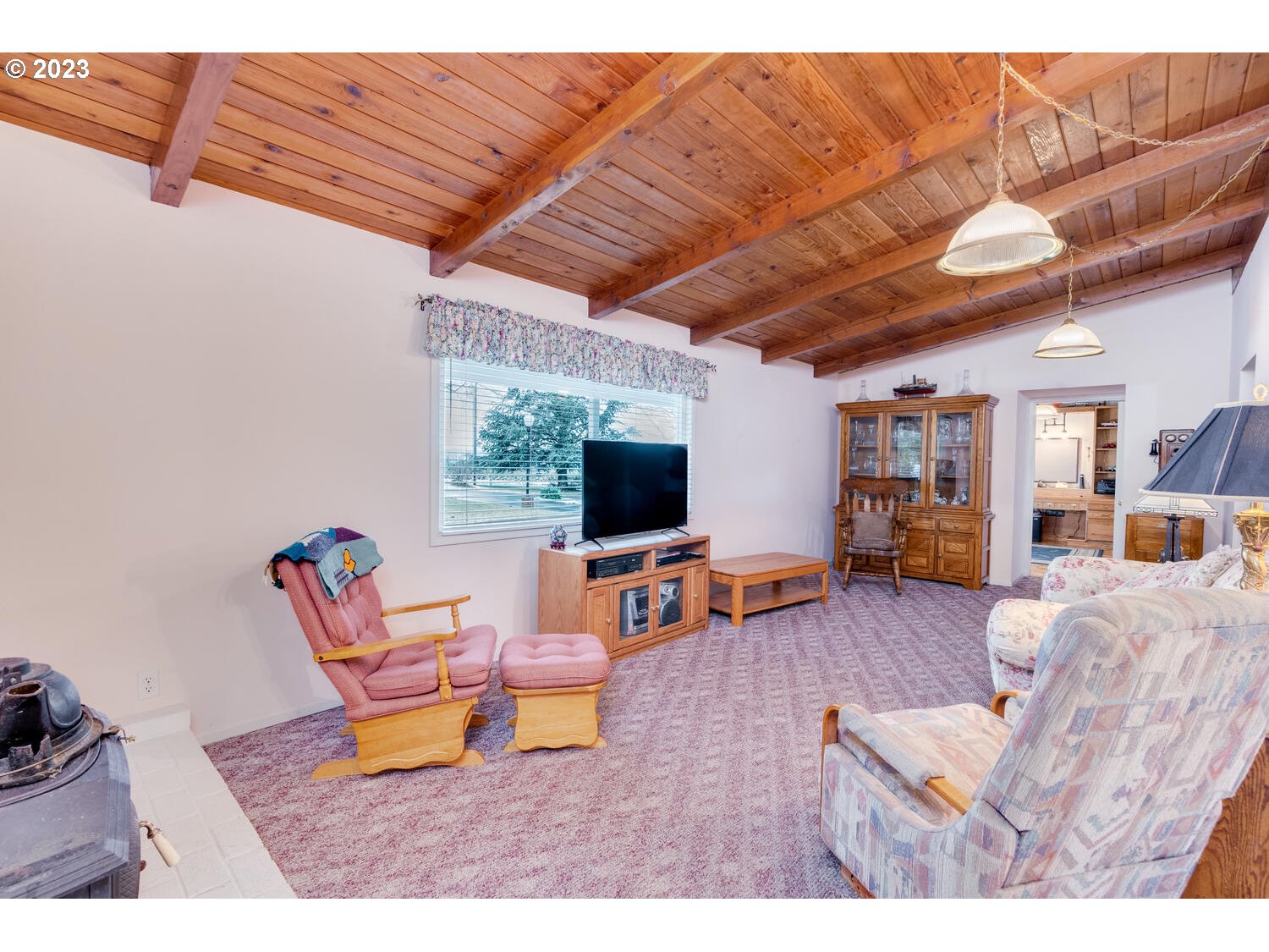 23728 South Springwater Road Estacada, OR 97023 - Photo 9 of 31 a living room with furniture and a flat screen tv
