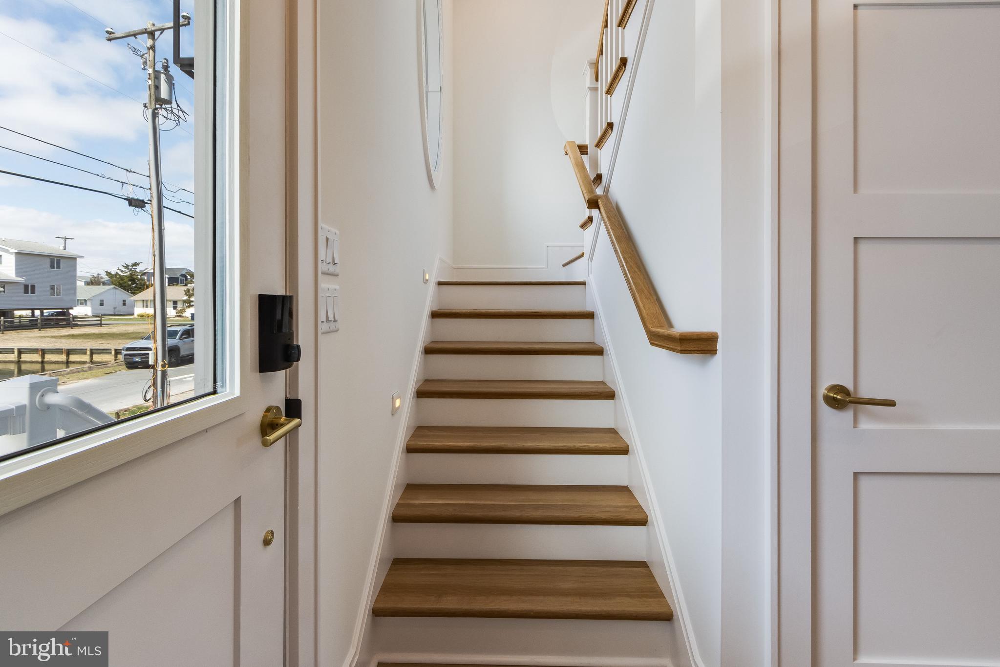 322 York Road South Bethany, DE 19930 - Photo 31 of 137 Light-Filled Staircase with Oak Treads