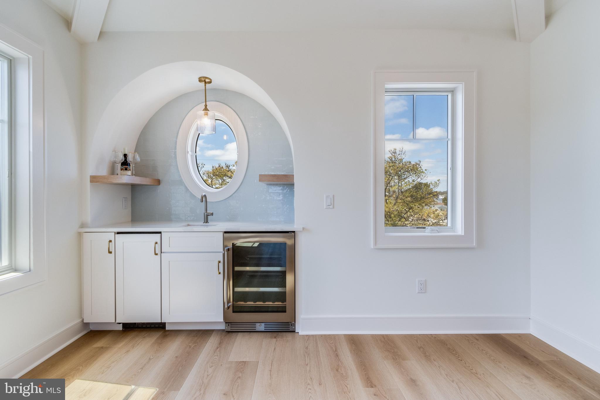 322 York Road South Bethany, DE 19930 - Photo 38 of 137 Arched Ceiling Wet Bar Nook w/ bev. fridge & ice