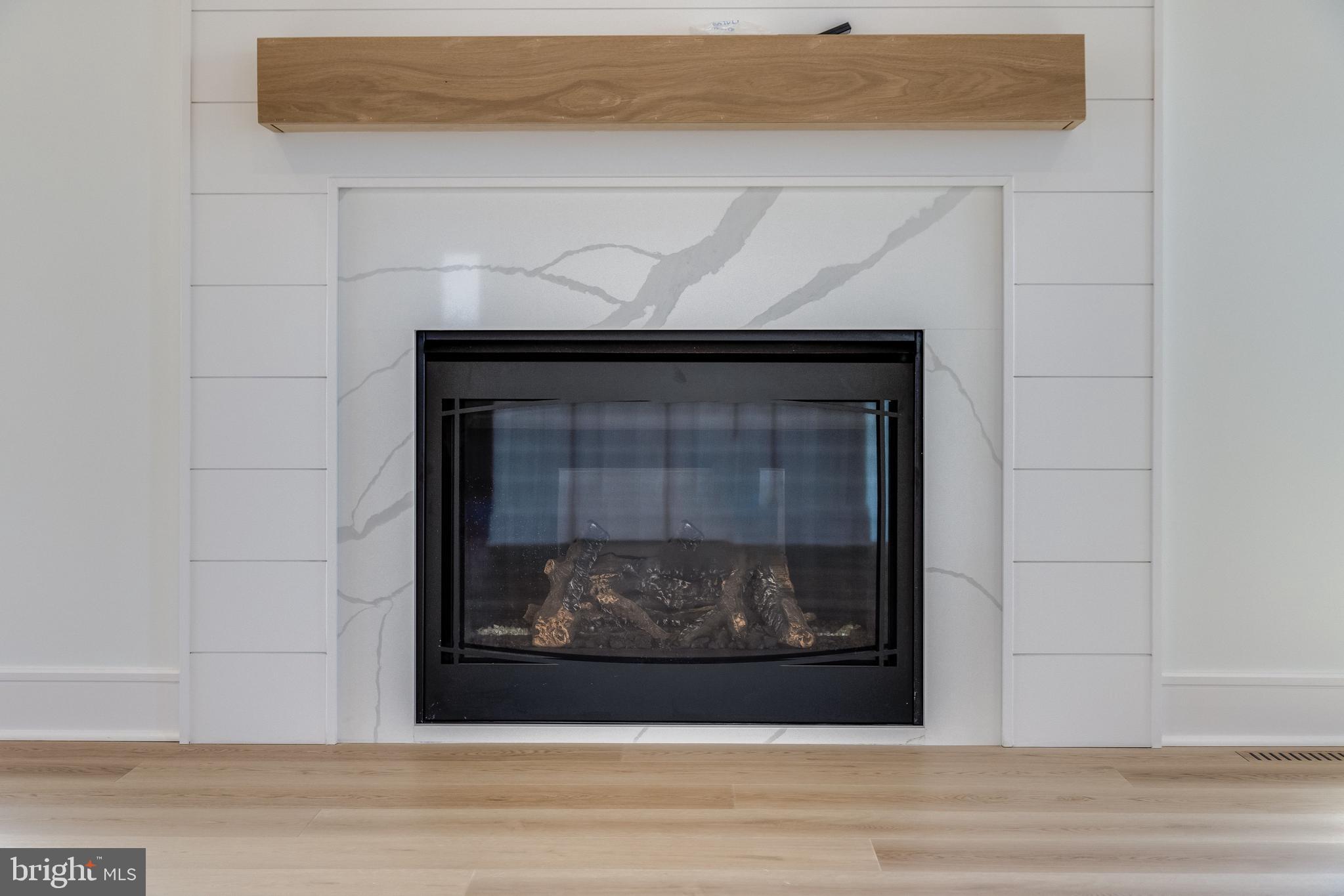 322 York Road South Bethany, DE 19930 - Photo 43 of 137 Quartz Surround Fireplace with Wood Mantel