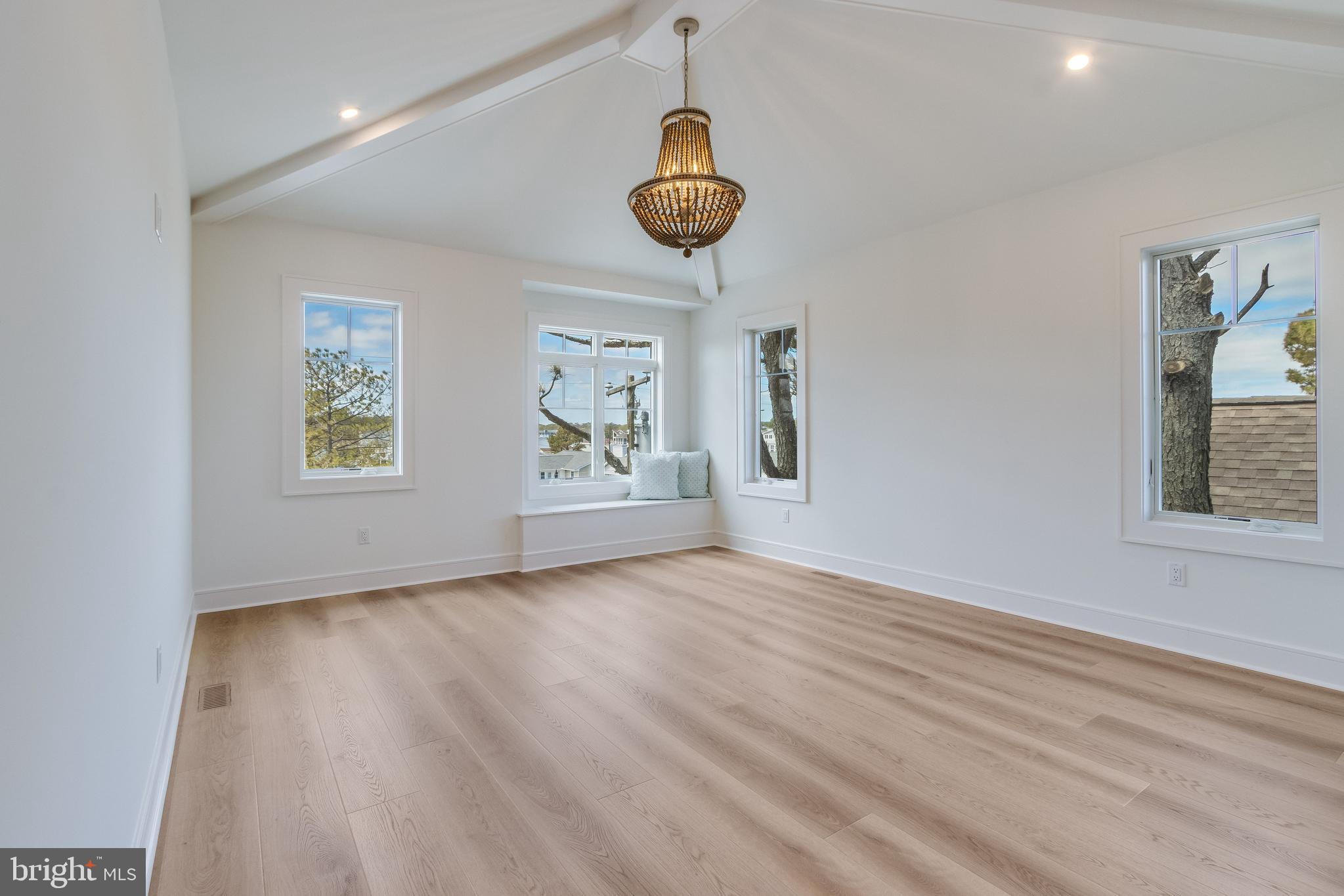 322 York Road South Bethany, DE 19930 - Photo 79 of 137 Vaulted ceiling with wood beams, views of the cana