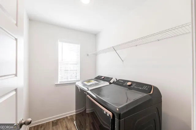 a utility room with a window dryer and washer