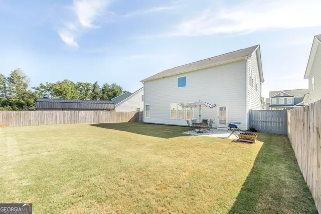 a view of a swimming pool with an outdoor space and seating area