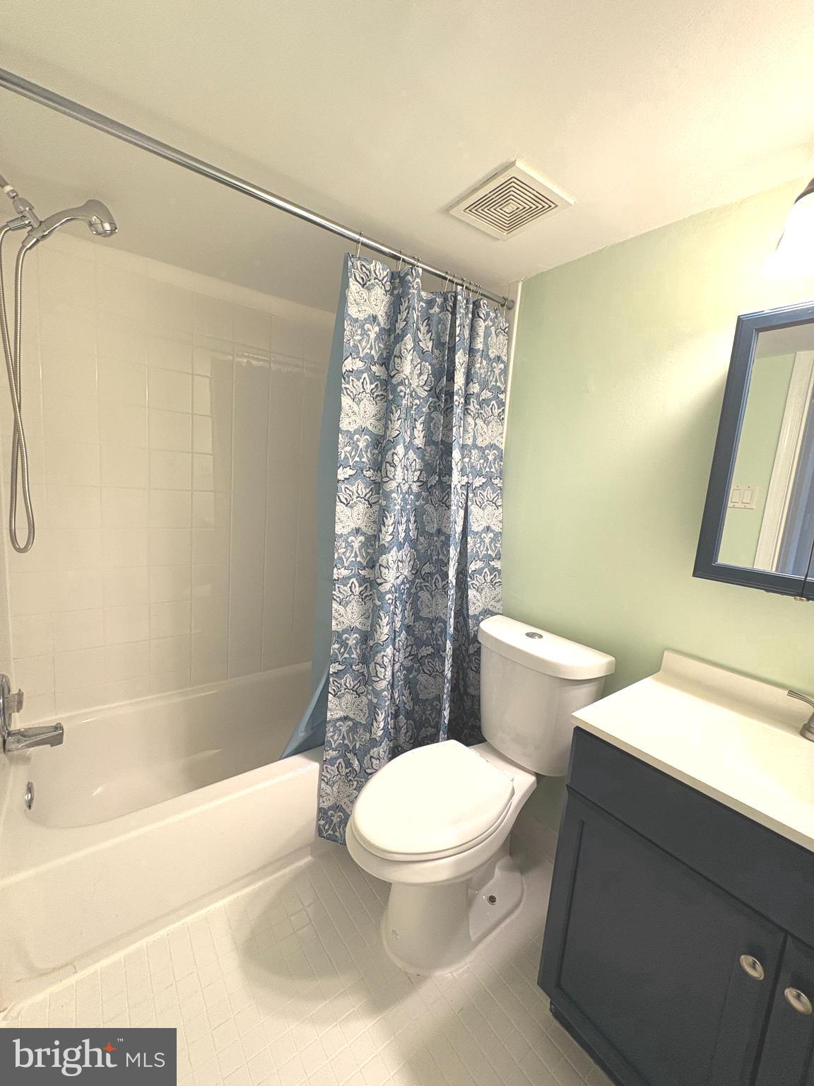 9432 Merryrest Road Columbia, MD 21045 - Photo 15 of 47 a white toilet sitting next to a bath tub and a shower