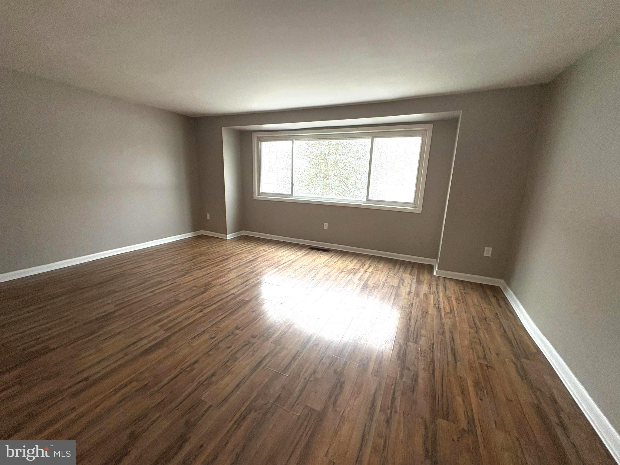 9432 Merryrest Road Columbia, MD 21045 - Photo 2 of 27 Large living room has great views of the trails!