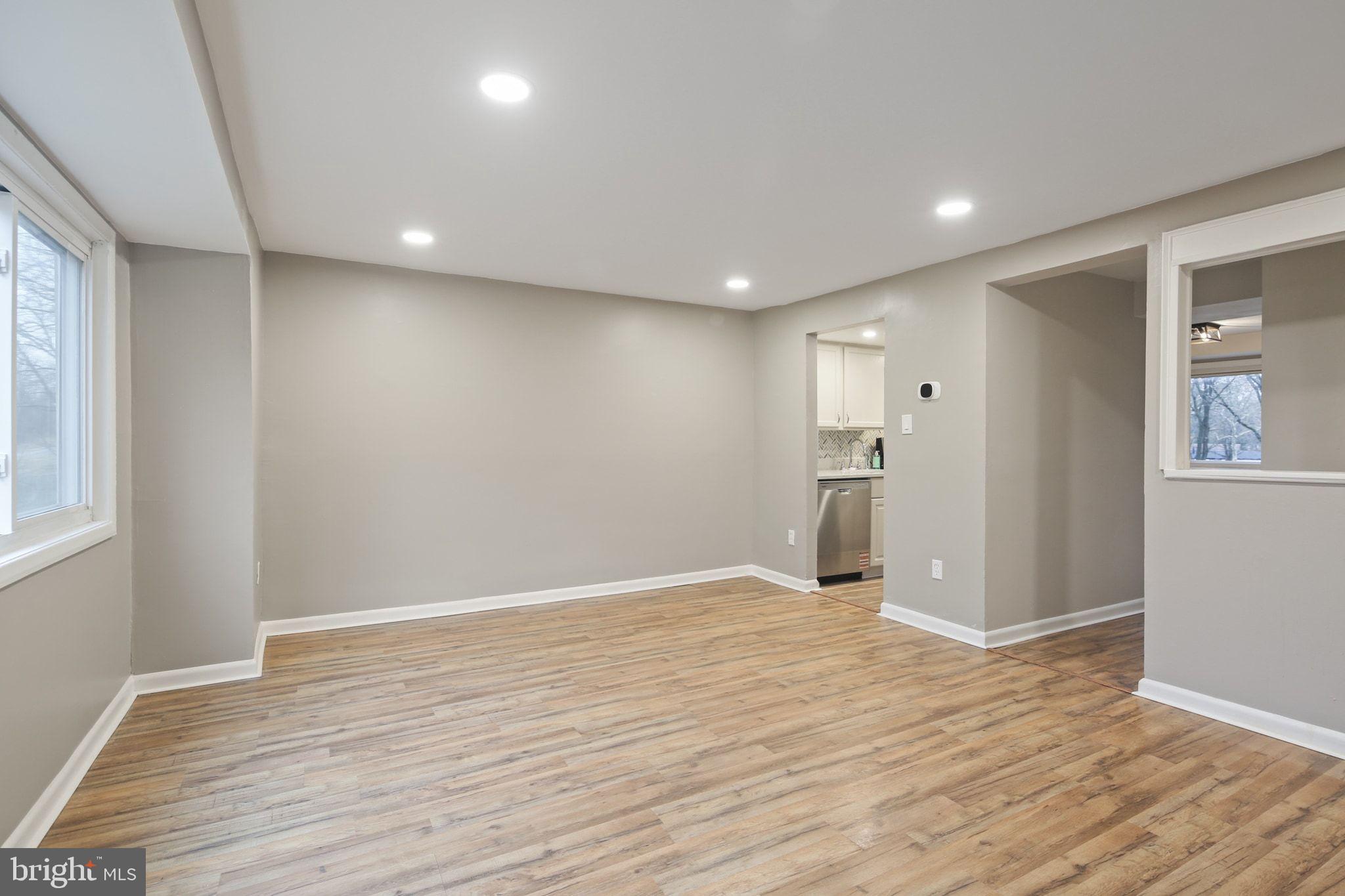 9432 Merryrest Road Columbia, MD 21045 - Photo 4 of 47 wooden floor in an empty room with a window