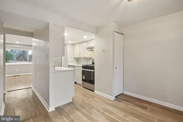 a bedroom with a bed and a mirror