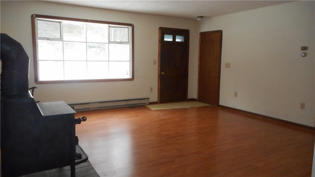 207 Coopers Mills Road Windsor, ME 04363 - Photo 11 of 20 Sunny living room with new flooring...