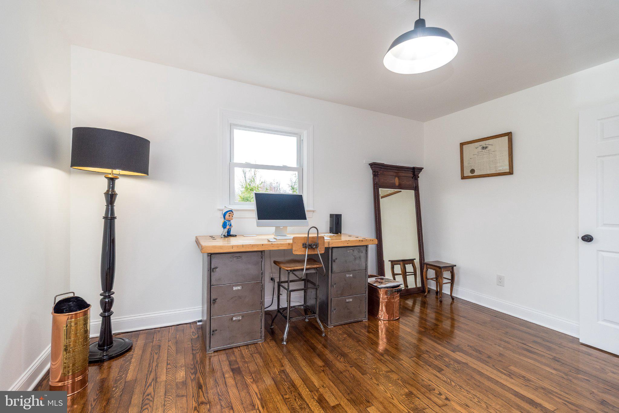 3645-57 Applebutter Road Fountainville, PA 18923 - Photo 67 of 98 a view of a workspace with furniture and wooden floor