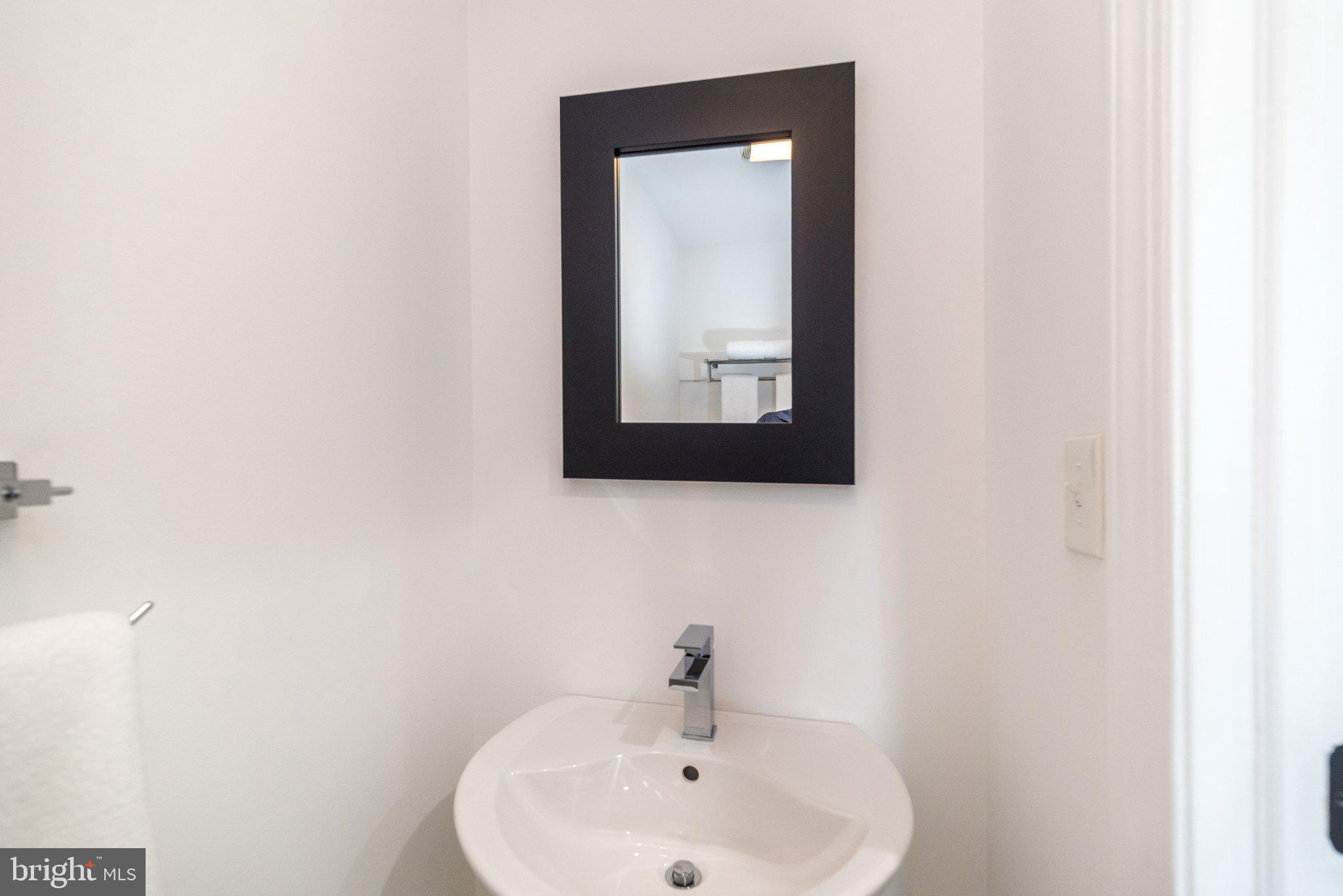 3645-57 Applebutter Road Fountainville, PA 18923 - Photo 71 of 98 a bathroom with a sink and a mirror