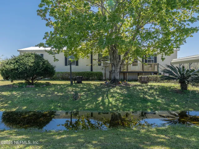 a backyard of a house with lots of green space