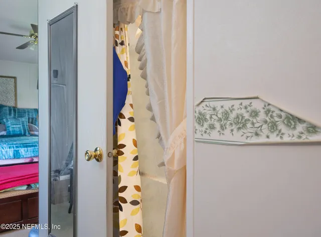 a bathroom with a granite countertop shower and a mirror