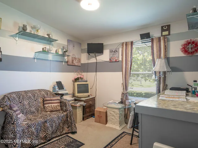 a living room with furniture and a window