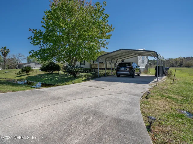 a view of a street with a car parked in front of it