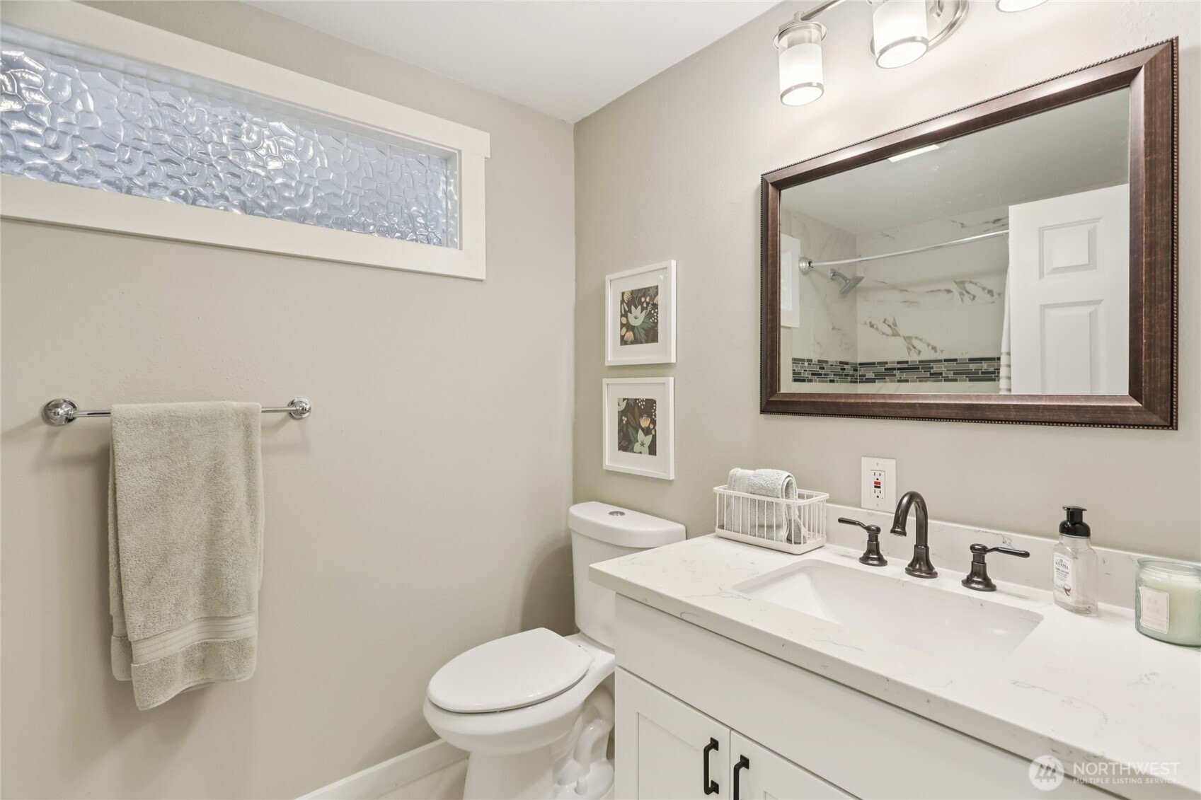 9512 235th Place Southwest Edmonds, WA 98020 - Photo 18 of 37 a bathroom with a sink vanity mirror and toilet