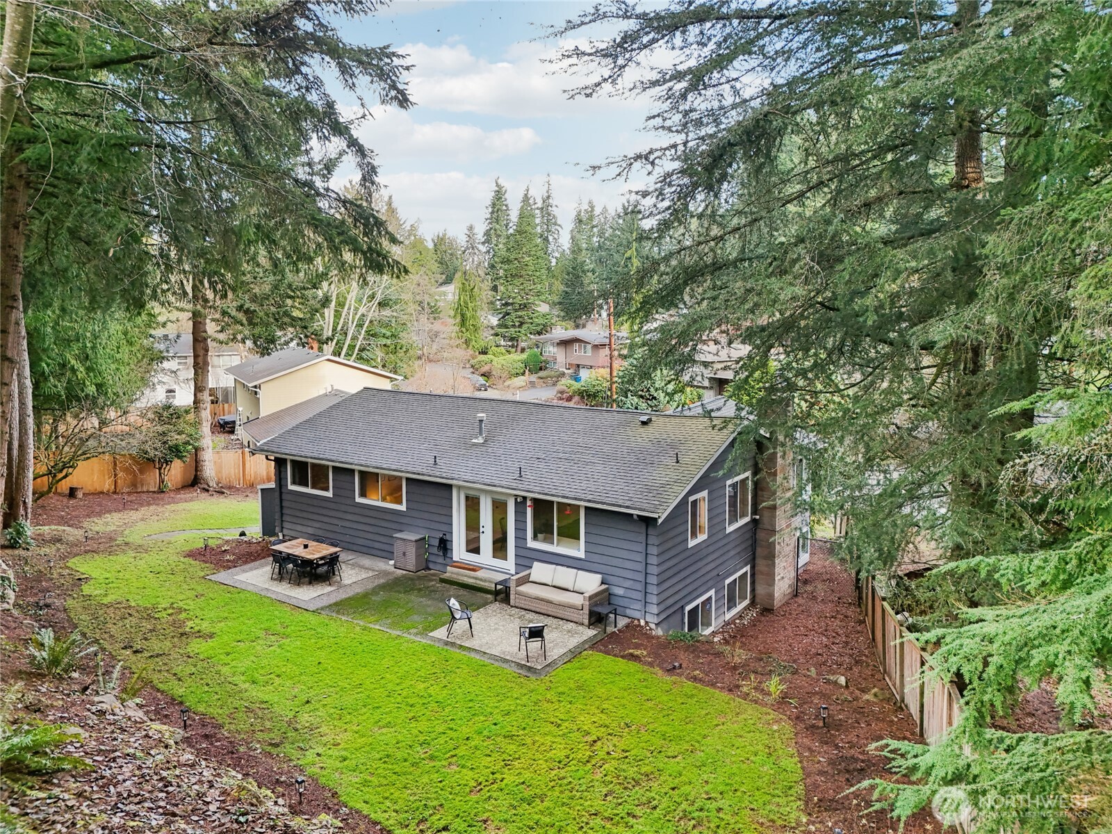 9512 235th Place Southwest Edmonds, WA 98020 - Photo 32 of 37 an aerial view of a house with swimming pool and yard