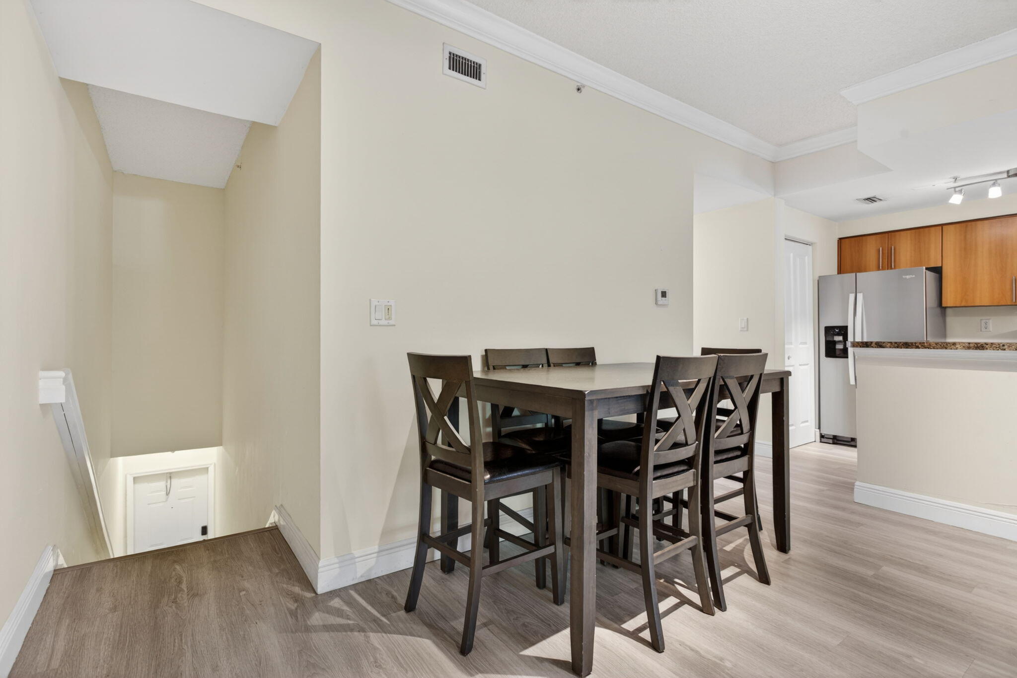 5880 West Sample Road, Unit 206 Coral Springs, FL 33067 - Photo 6 of 37 a view of a dining room with furniture and wooden floor