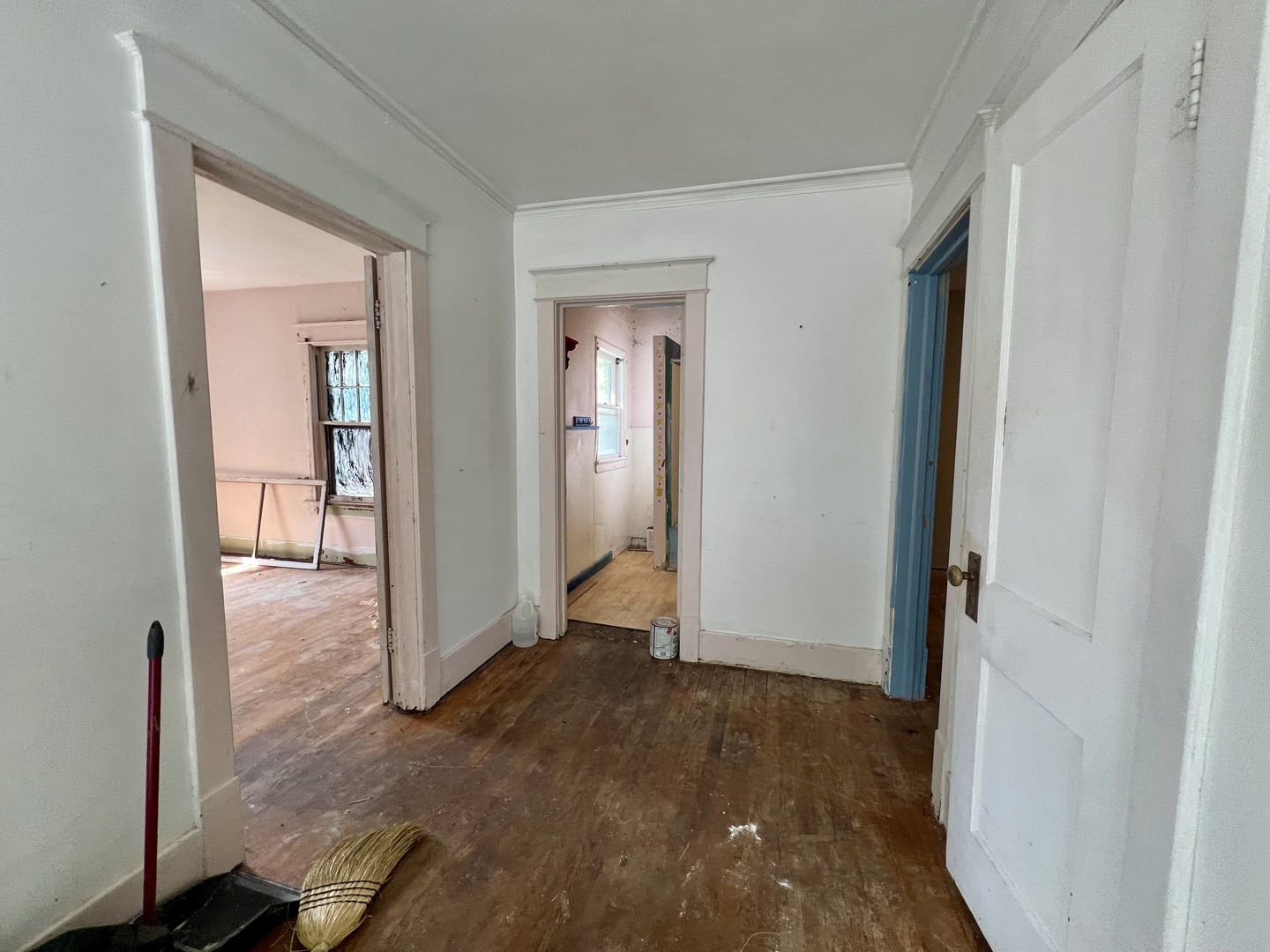 212 Vine Street Villa Grove, IL 61956 - Photo 19 of 36 a view of a hallway with wooden floor and closet