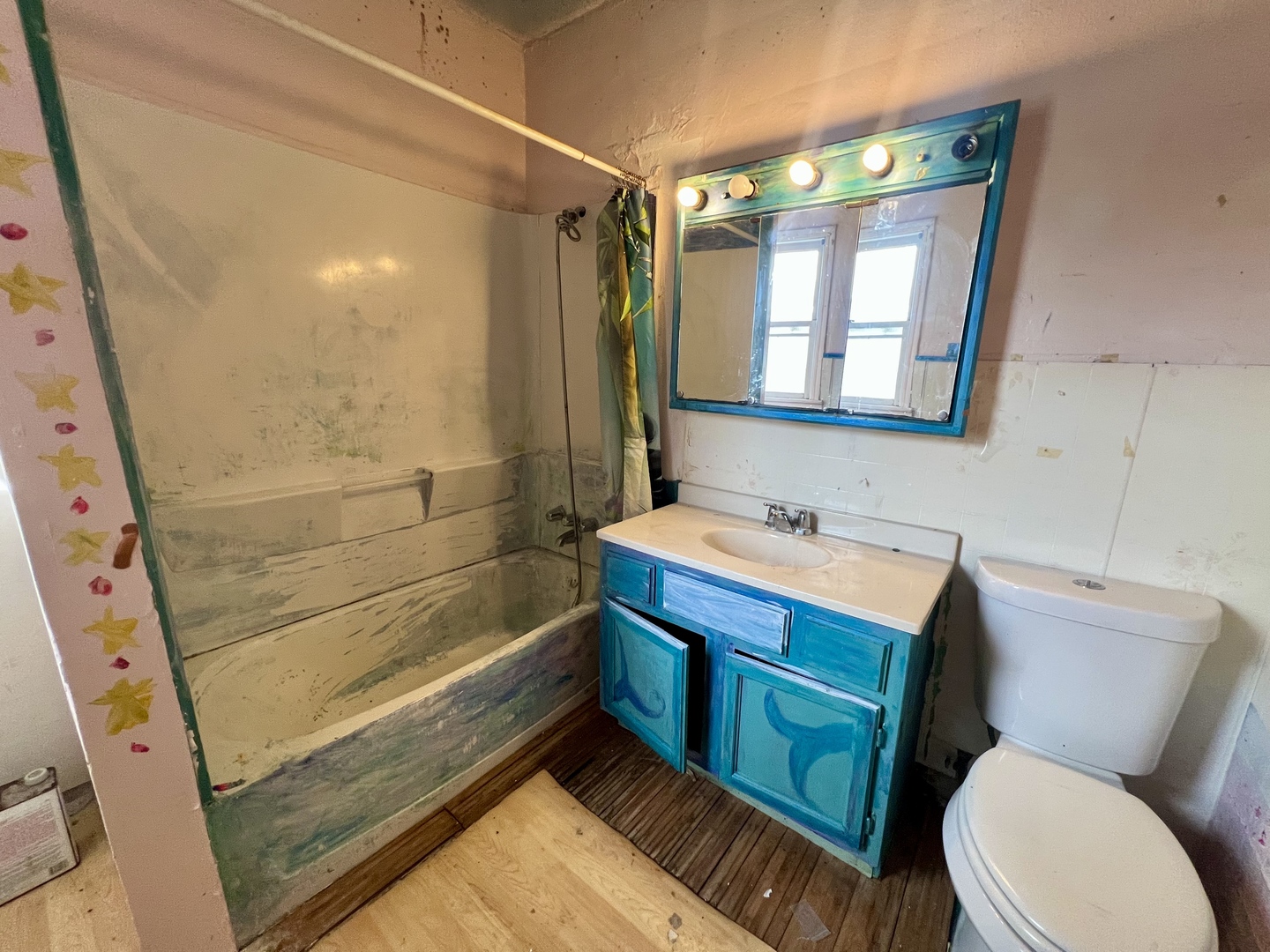212 Vine Street Villa Grove, IL 61956 - Photo 25 of 36 a bathroom with a sink a toilet and shower