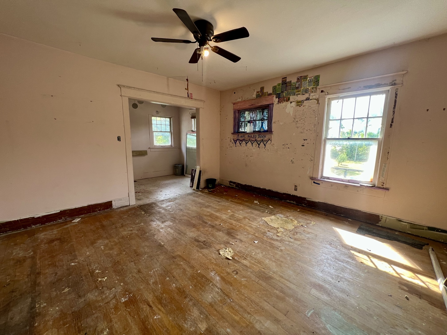 212 Vine Street Villa Grove, IL 61956 - Photo 27 of 36 wooden floor in an empty room with a window