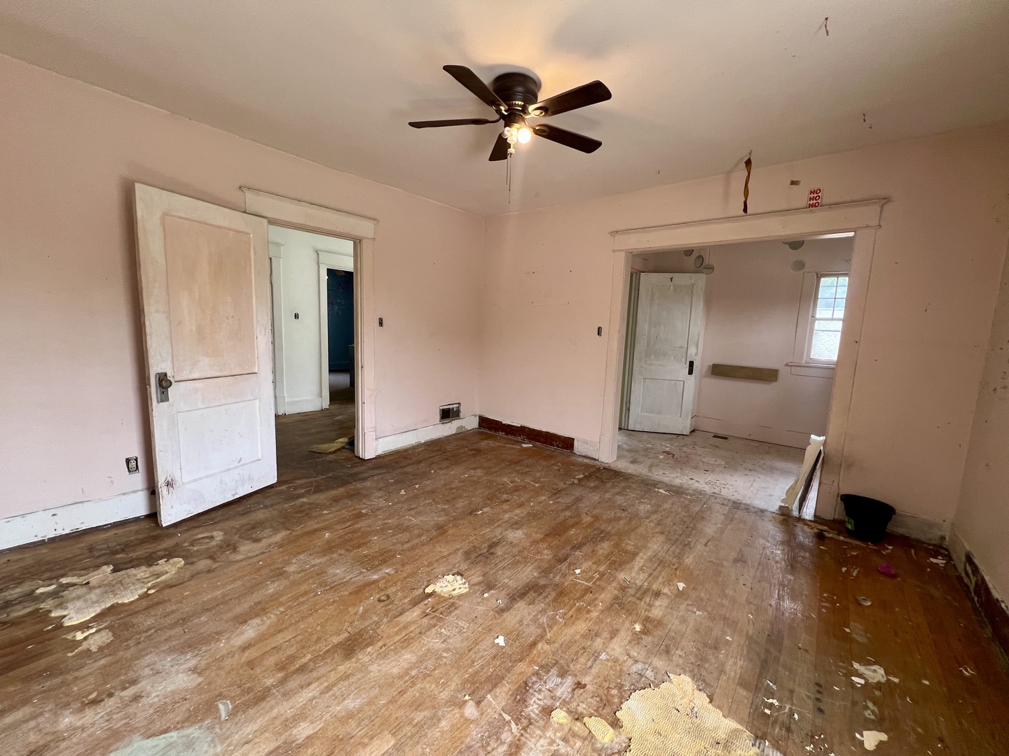 212 Vine Street Villa Grove, IL 61956 - Photo 28 of 36 a view of empty room with wooden floor and ceiling fan