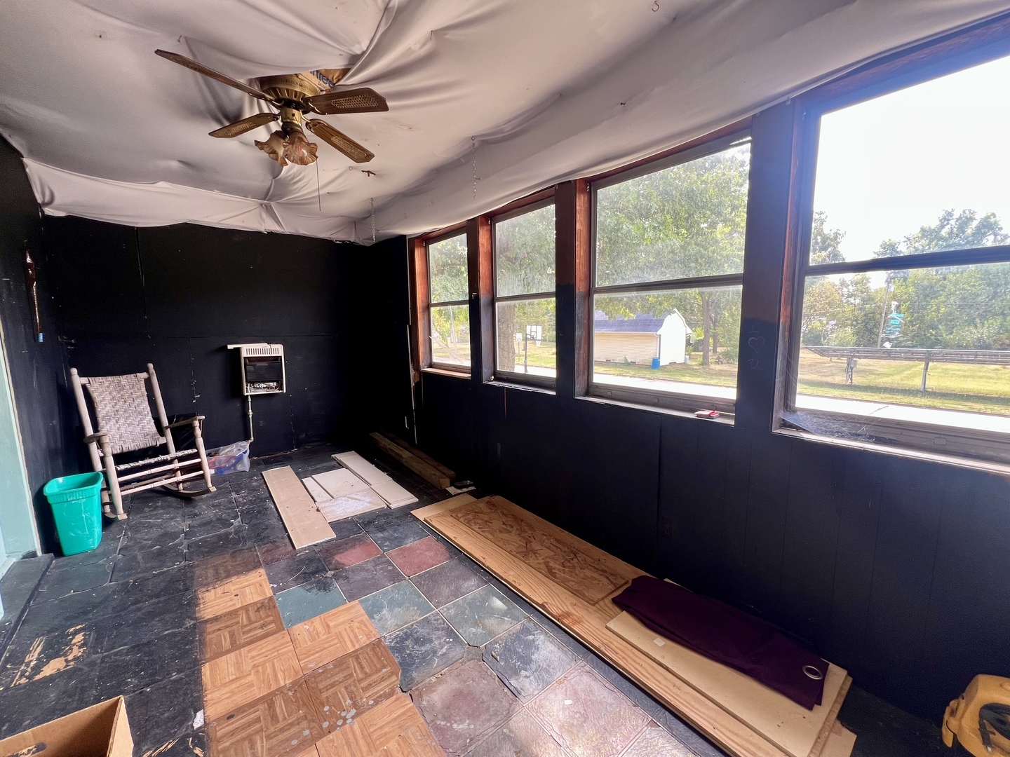 212 Vine Street Villa Grove, IL 61956 - Photo 3 of 36 a bed room with a window and a ceiling fan