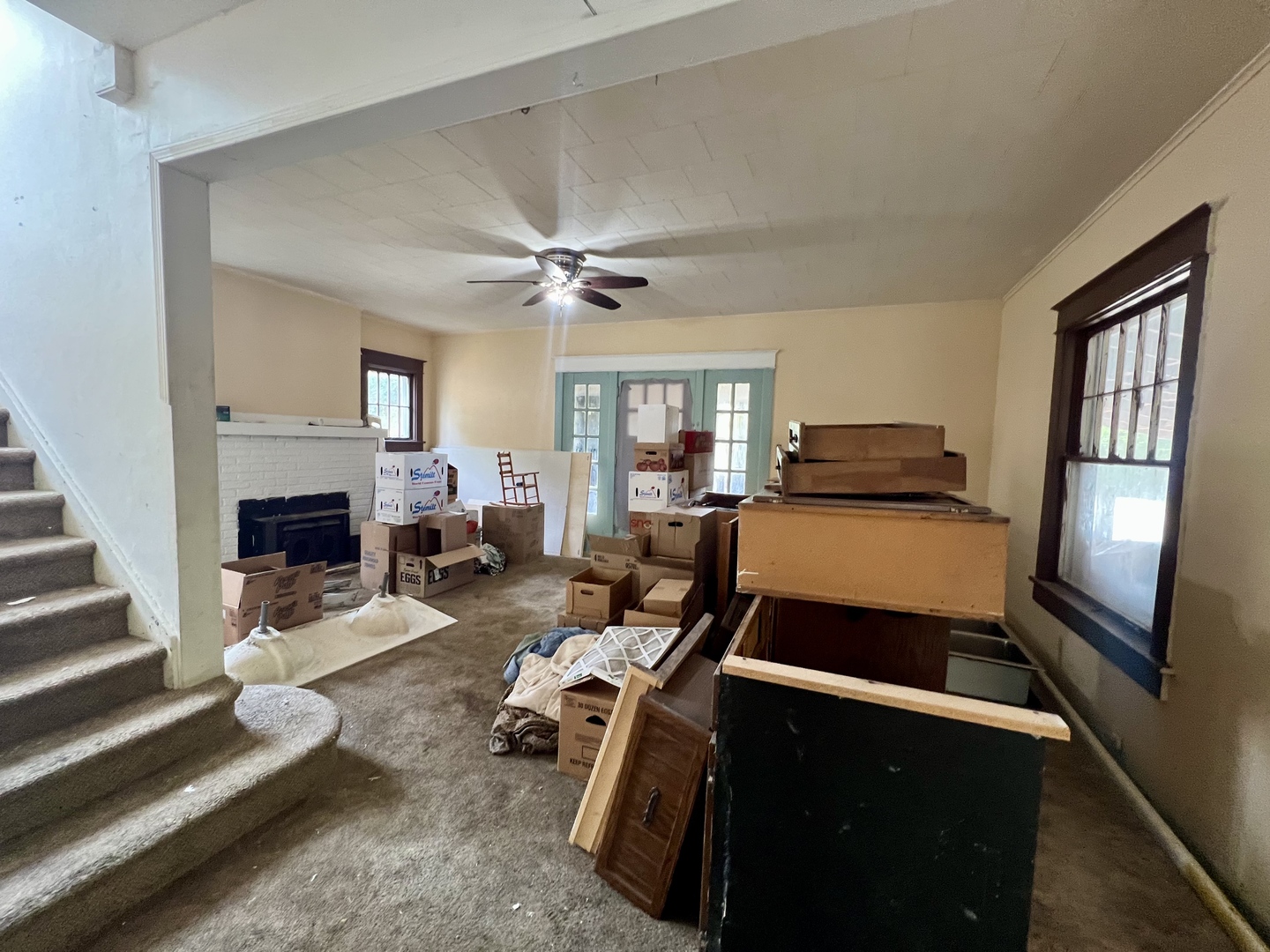 212 Vine Street Villa Grove, IL 61956 - Photo 4 of 36 a living room with furniture and a fireplace