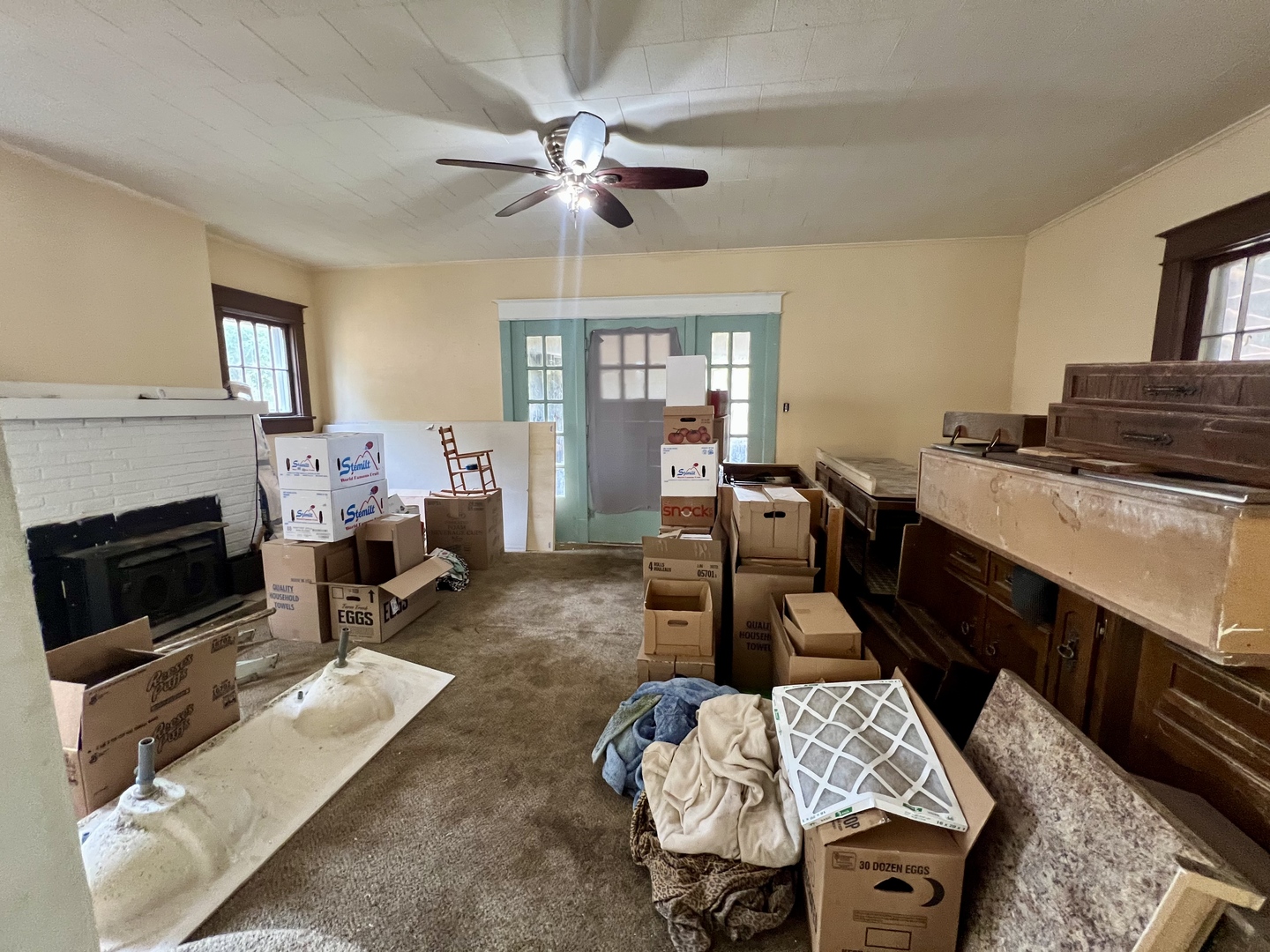 212 Vine Street Villa Grove, IL 61956 - Photo 5 of 36 a living room with furniture fireplace and a window