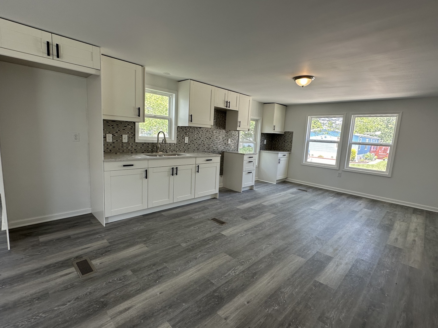 66 Candlegate Circle Matteson, IL 60443 - Photo 2 of 21 a kitchen with granite countertop a stove a sink and a refrigerator