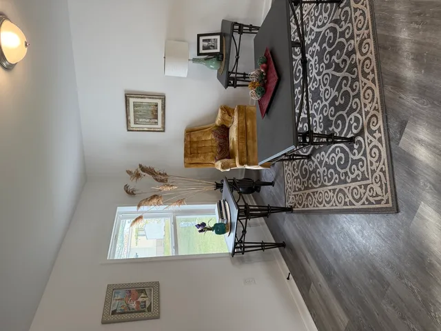 a view of hall way with furniture